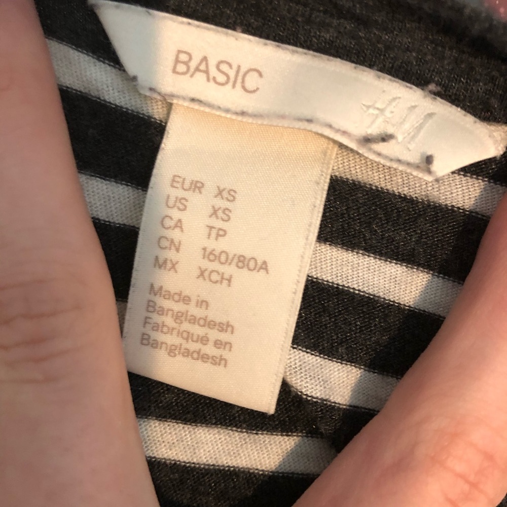 A Basic stripped shirt with yellow stitching